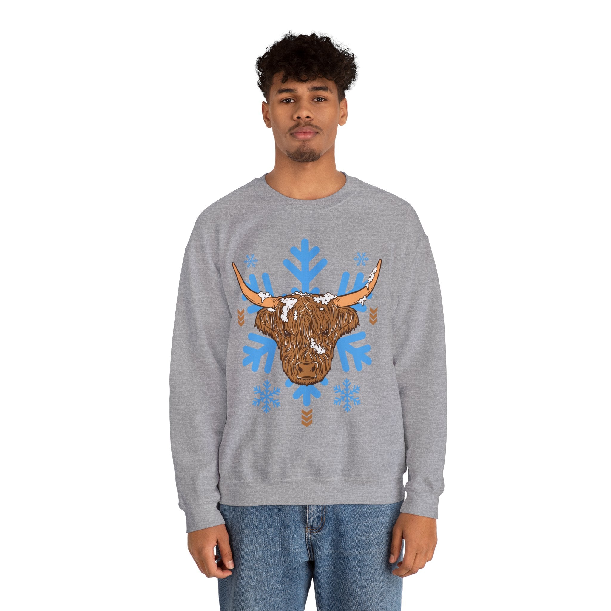 Shaggy brown Highland cow head centered over large light-blue snowflakes, detail