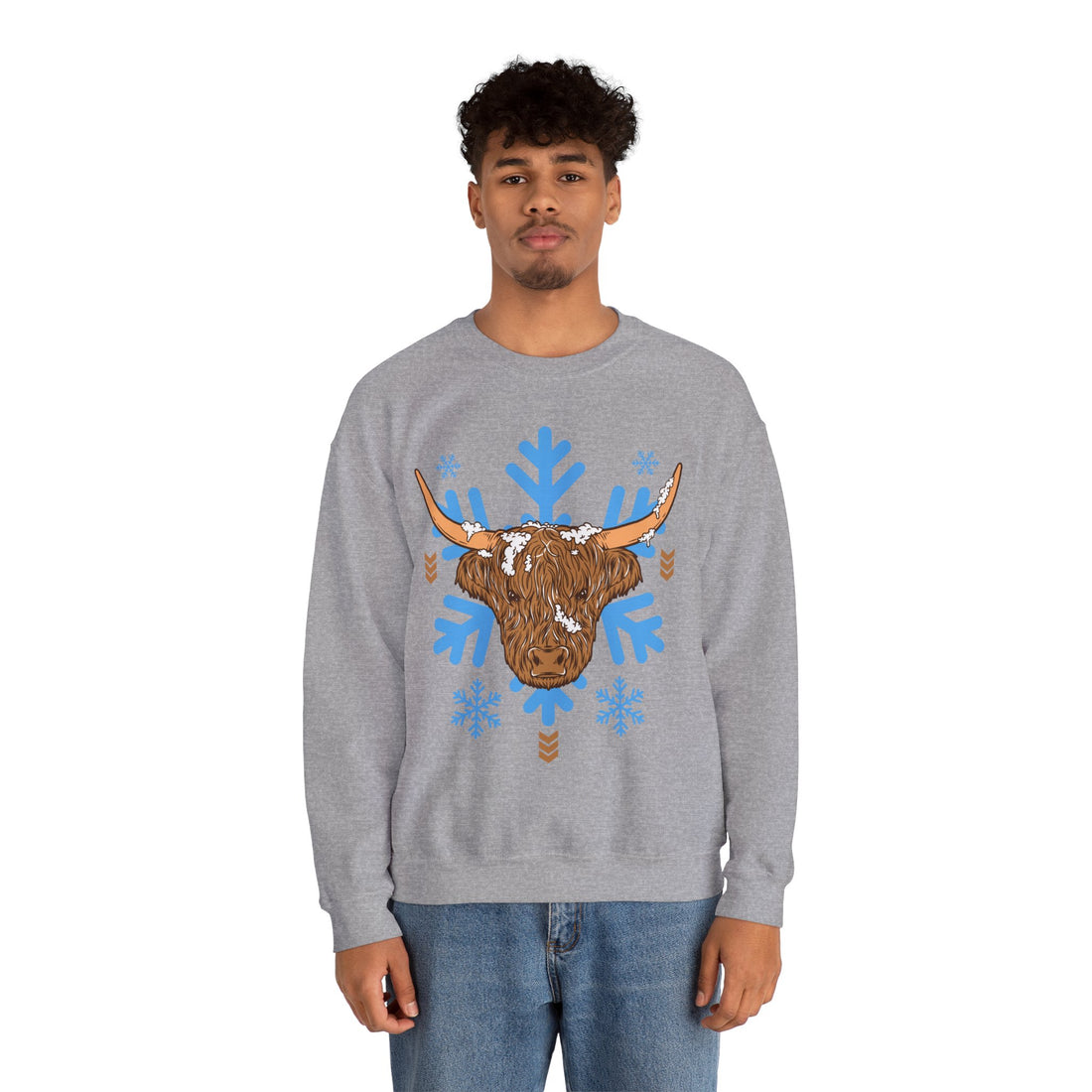 Shaggy brown Highland cow head centered over large light-blue snowflakes, detail