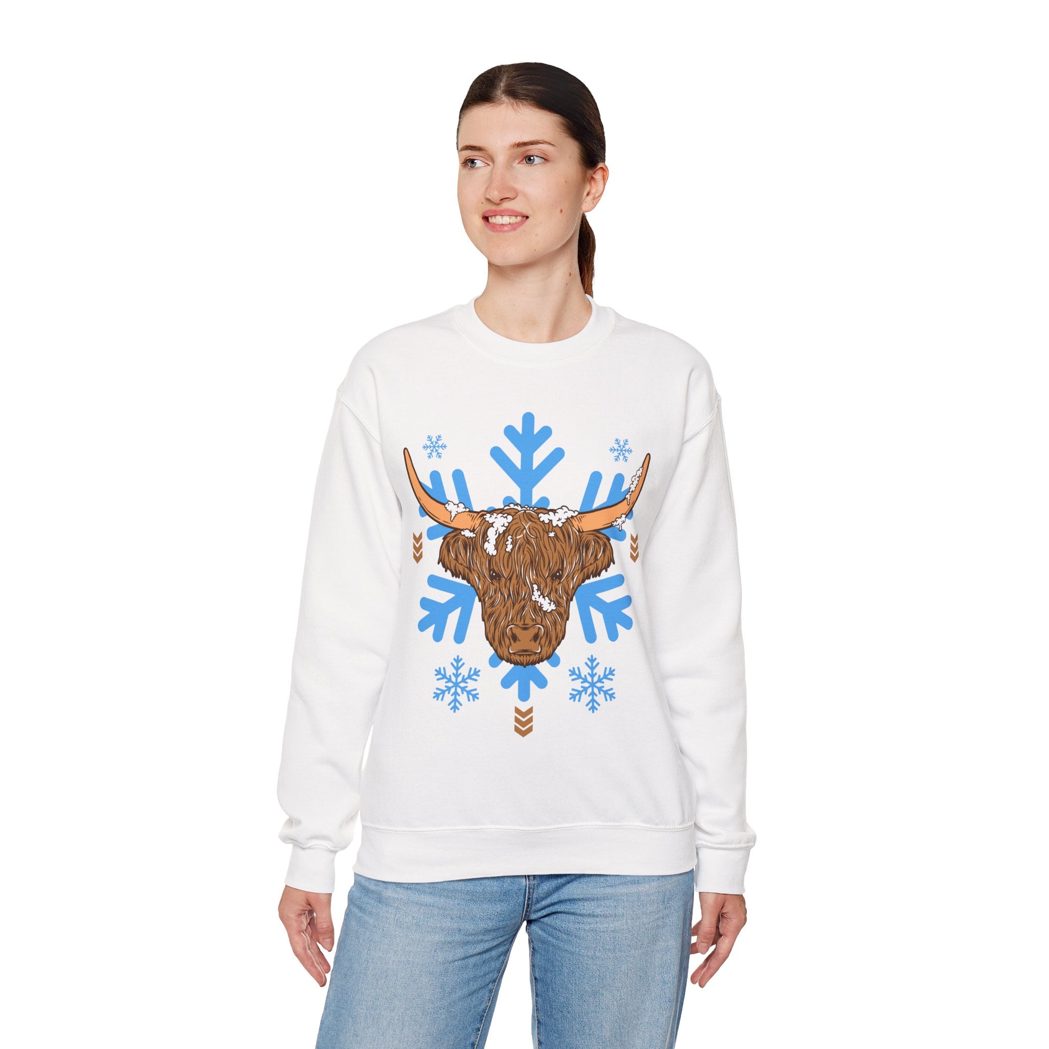 Shaggy brown Highland cow head centered over large light-blue snowflakes, color option