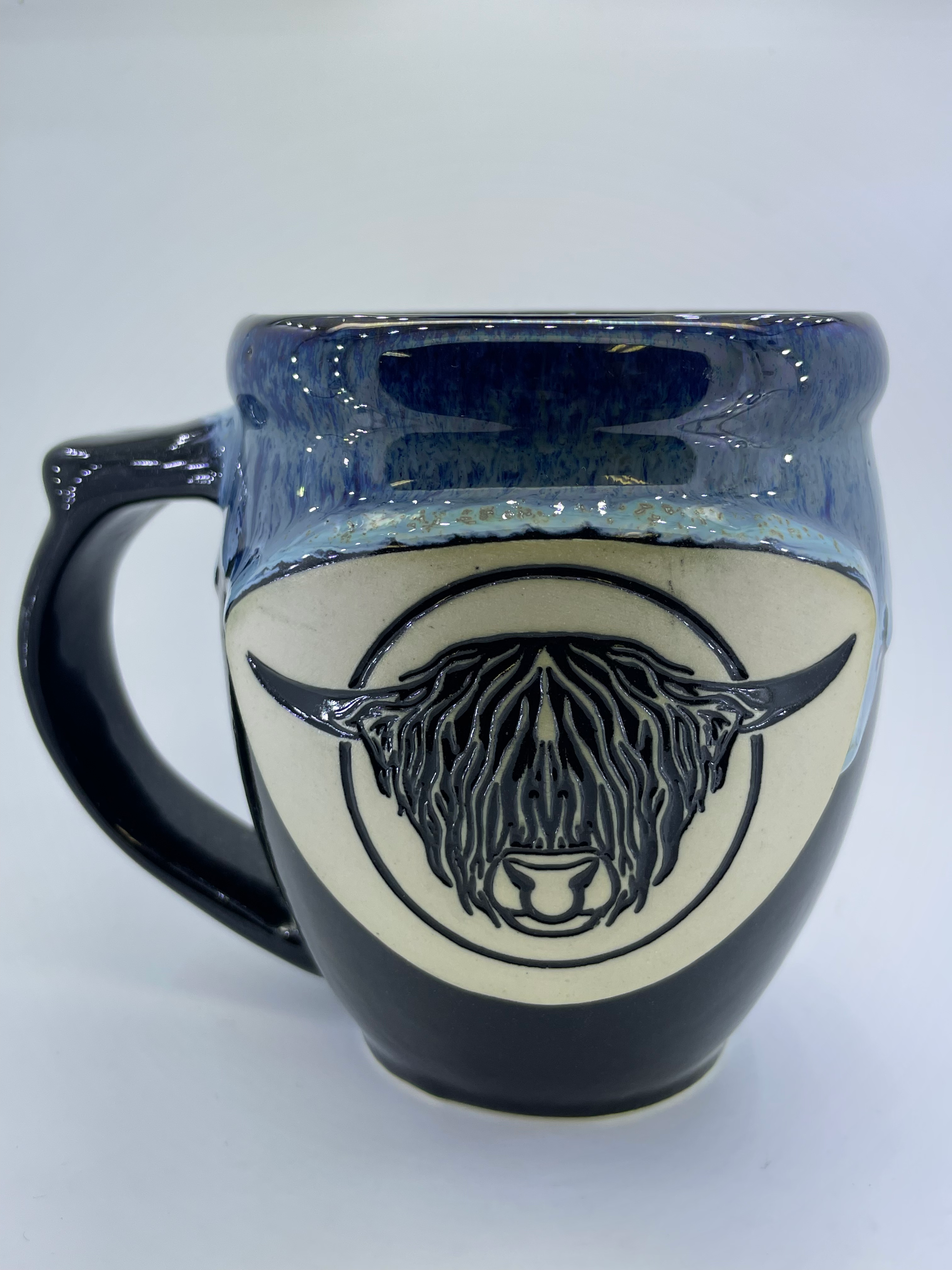 Handmade pottery mug with Highland bull head, detail