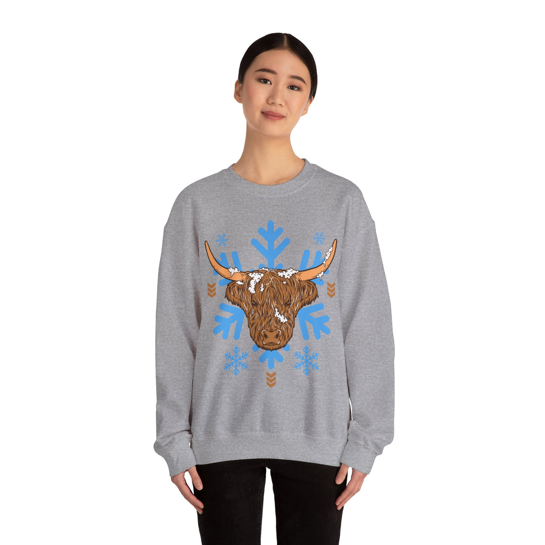 Shaggy brown Highland cow head centered over large light-blue snowflakes, color option