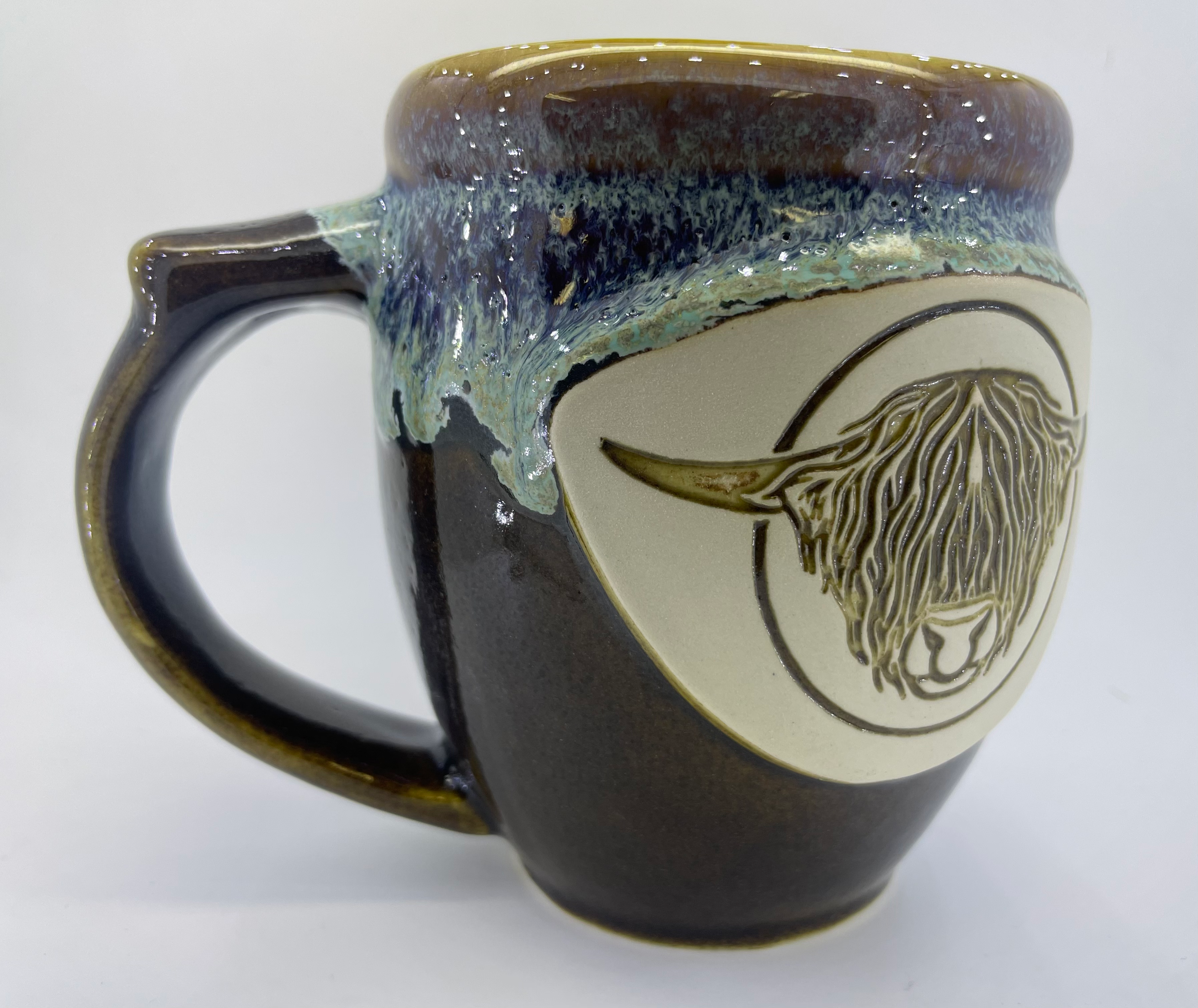 Handmade pottery mug with Highland bull head, detail
