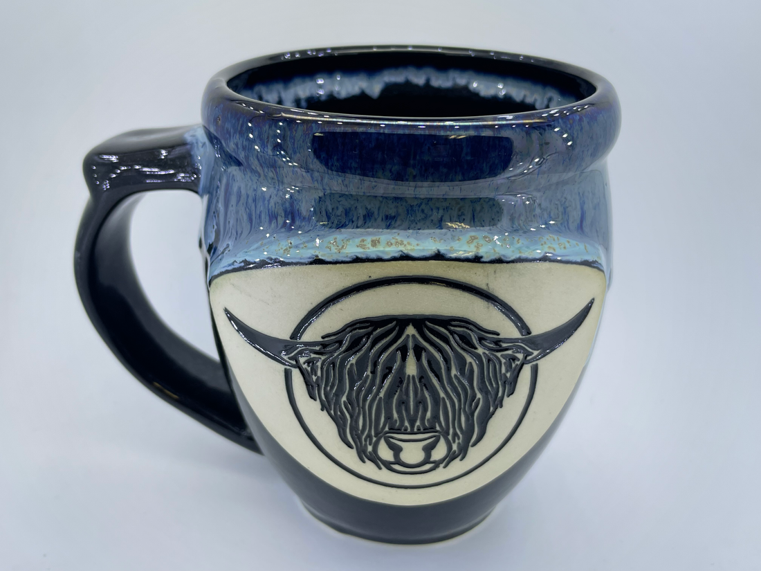 Handmade pottery mug with Highland bull head, detail
