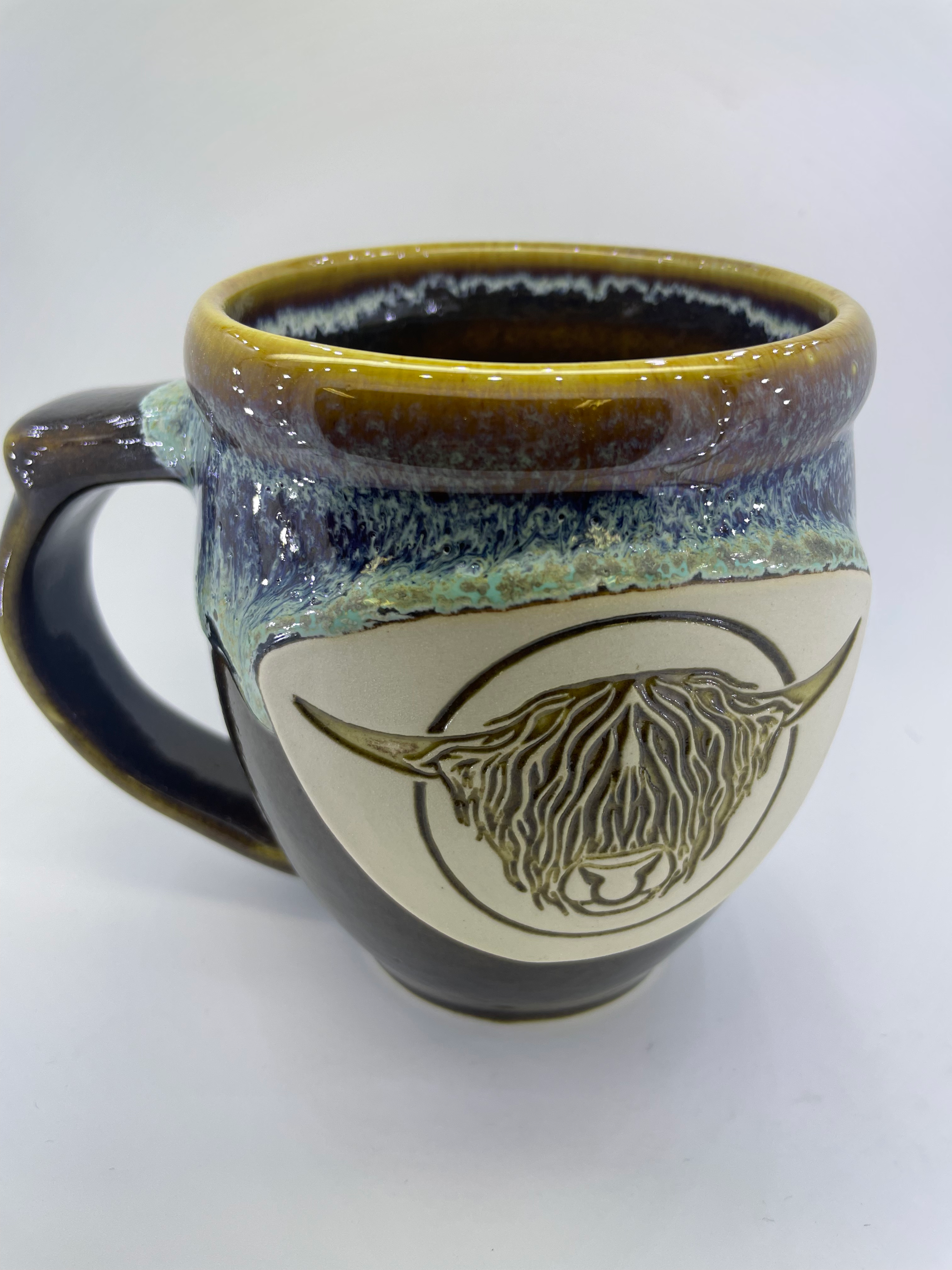 Handmade pottery mug with Highland bull head, alternate view