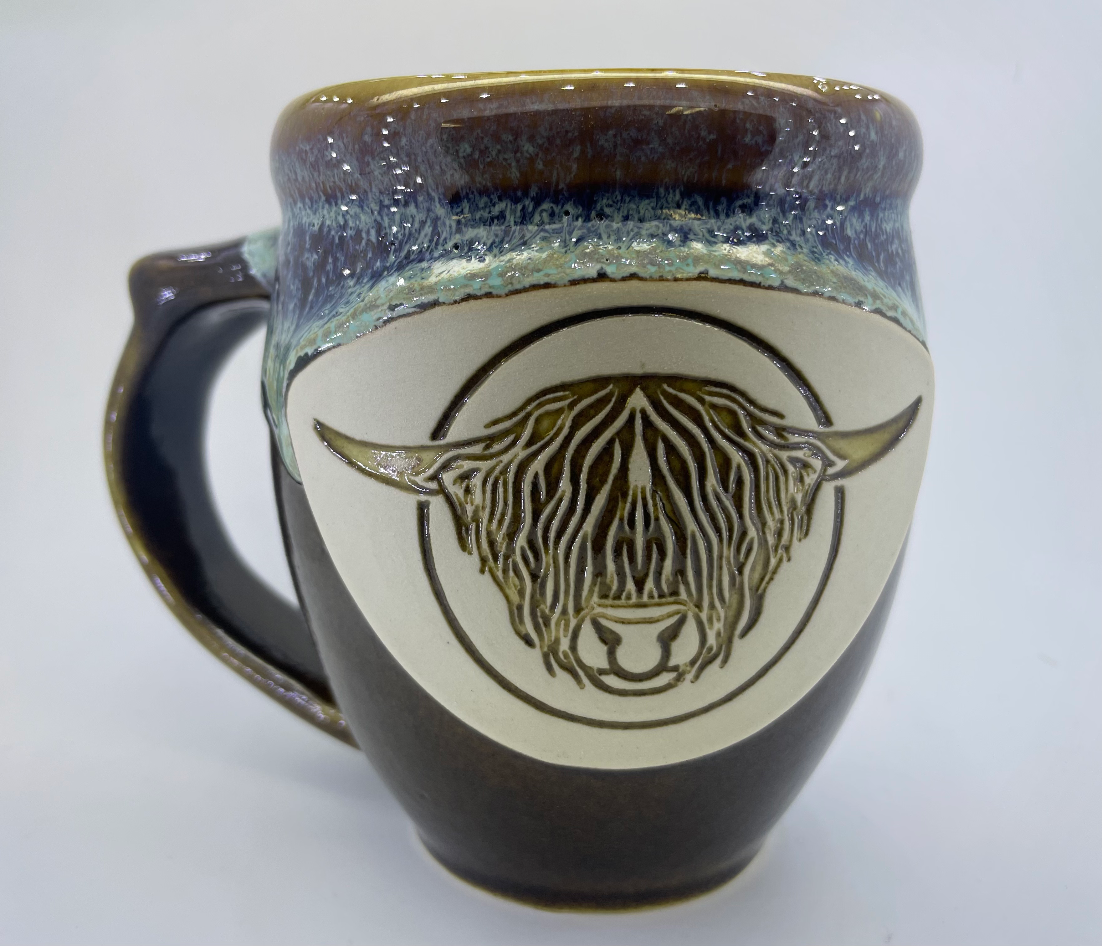 Handmade pottery mug with Highland bull head, detail