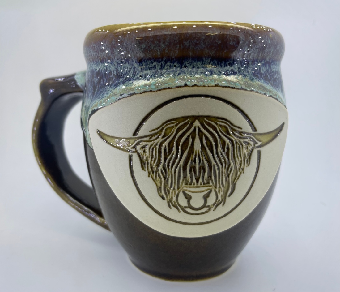 Handmade pottery mug with Highland bull head, detail